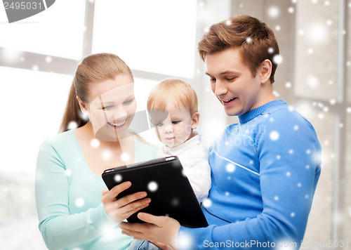 Image of parents and adorable baby with tablet pc