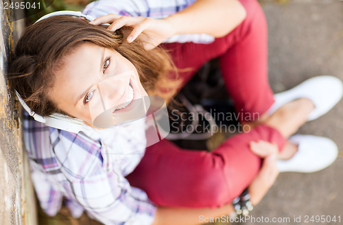 Image of girl with headphones listening to music