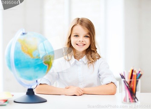 Image of student girl with globe at school