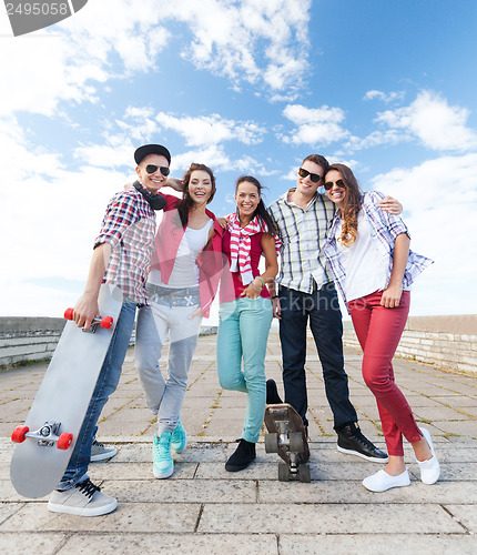 Image of teenagers with skates outside