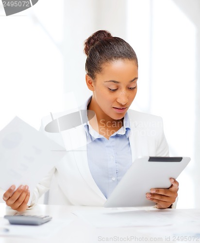 Image of businesswoman with tablet pc in office