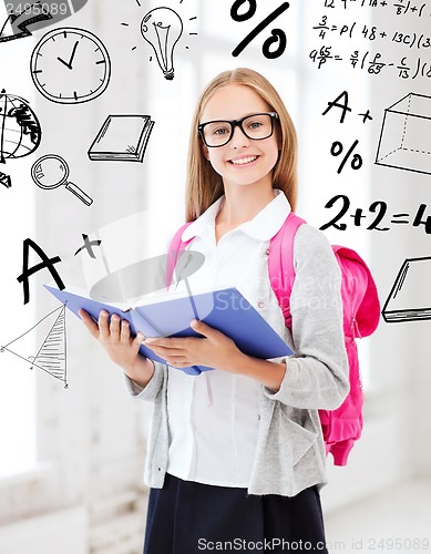 Image of girl reading book at school