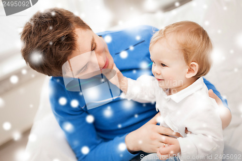 Image of happy father with adorable baby