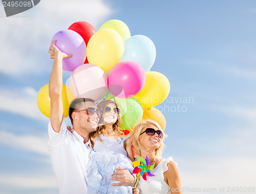 Image of family with colorful balloons