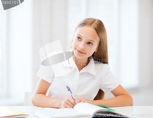 Image of student girl studying at school