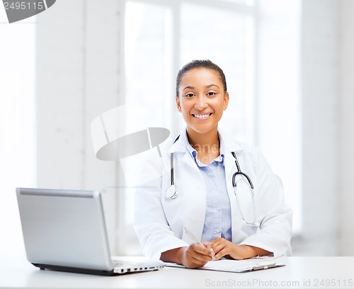 Image of female doctor with laptop pc