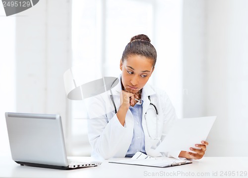 Image of female doctor with laptop pc