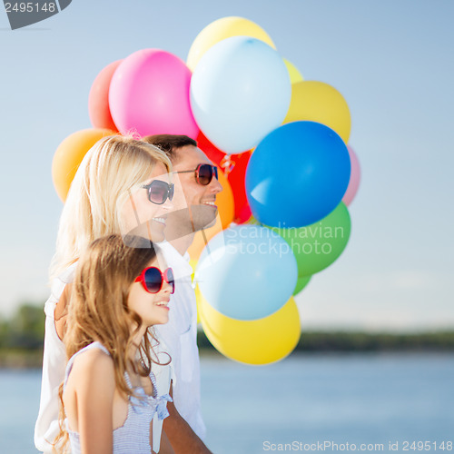 Image of family with colorful balloons