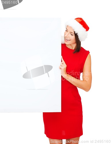Image of woman in santa helper hat with blank white board