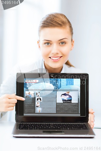 Image of woman showing laptop pc with news