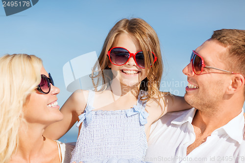 Image of happy family with blue sky