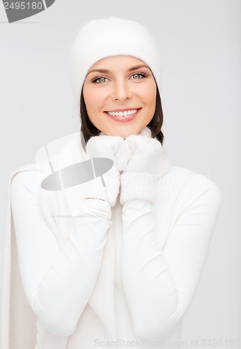 Image of woman in hat, muffler and gloves