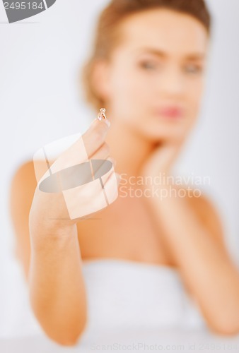 Image of woman with wedding ring