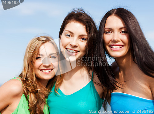 Image of girls walking on the beach