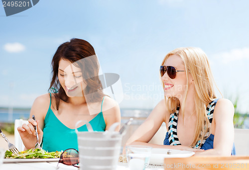 Image of girls in cafe on the beach