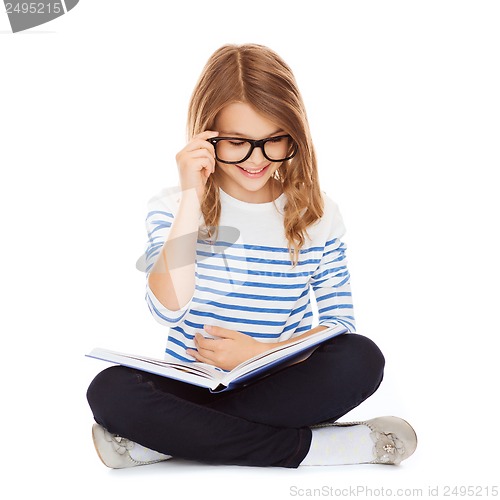 Image of student girl studying and reading book
