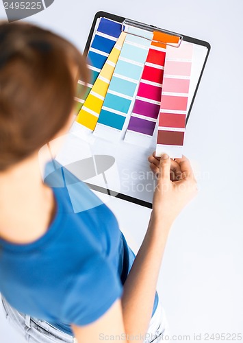 Image of woman working with color samples for selection
