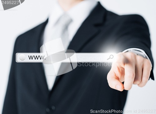 Image of businessman pressing Search button