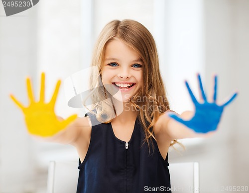 Image of girl showing painted hands