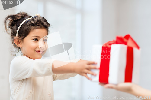 Image of happy child girl with gift box