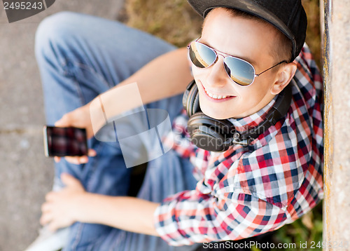 Image of girl with headphones and smartphone