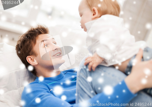 Image of happy father with adorable baby