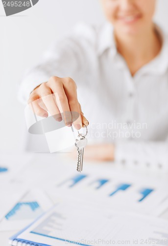 Image of woman hand holding house keys