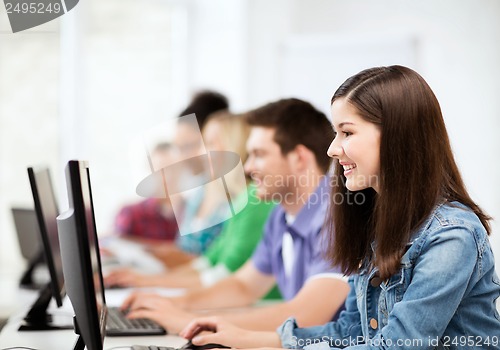 Image of students with computers studying at school