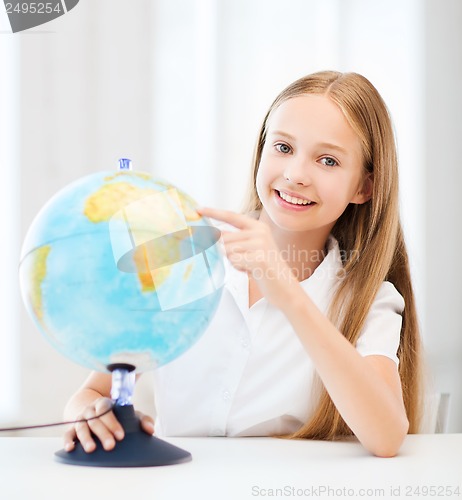 Image of student girl with globe at school