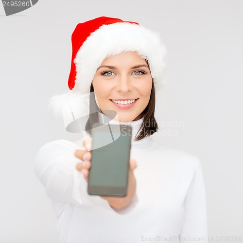 Image of woman in santa helper hat with smartphone