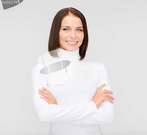 Image of smiling woman in white sweater