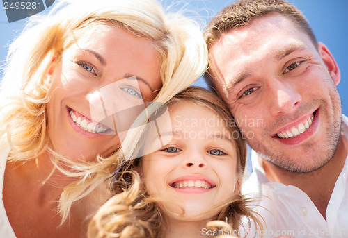 Image of happy family with blue sky