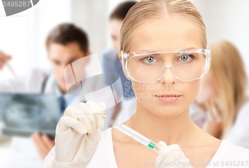 Image of scientist holding thermometer