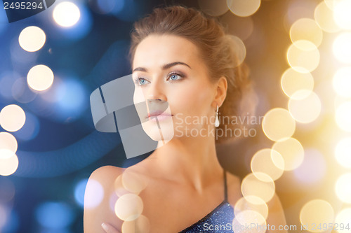 Image of woman with diamond earrings