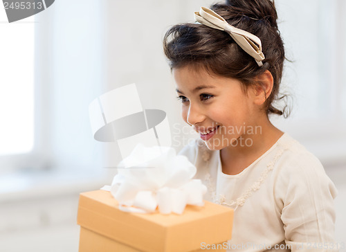 Image of happy child girl with gift box