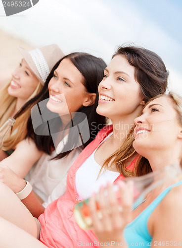 Image of girls with drinks on the beach