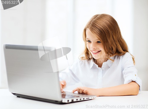 Image of girl with laptop pc at school