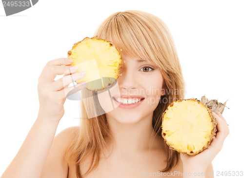 Image of happy girl with pineapple