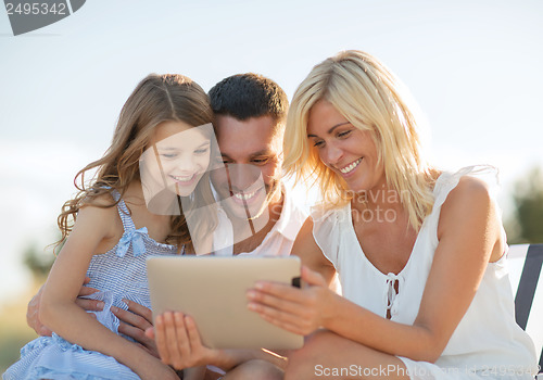 Image of happy family with tablet pc taking picture