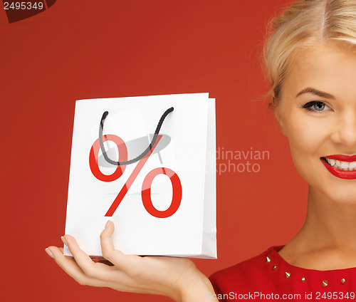 Image of woman holding bag with percent sign