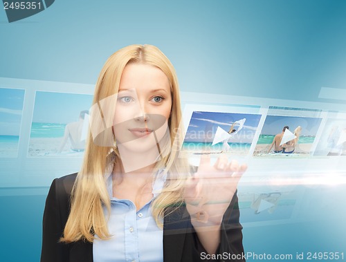 Image of businesswoman with virtual screen