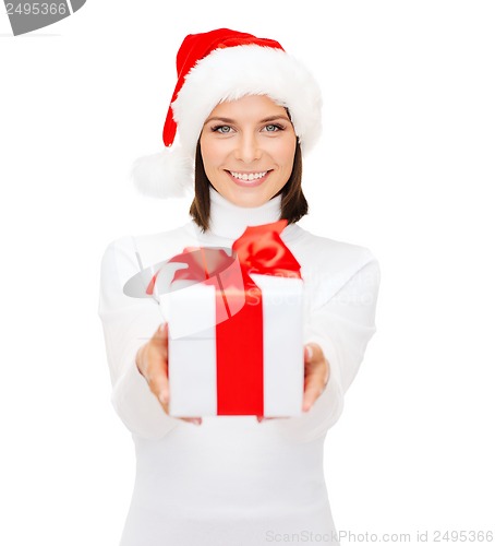 Image of smiling woman in santa helper hat with gift box