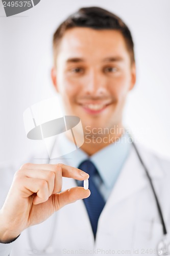 Image of doctor with pill in hospital