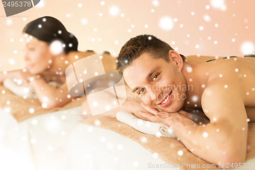 Image of couple in spa with hot stones