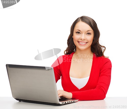 Image of smiling woman in red clothes with laptop computer