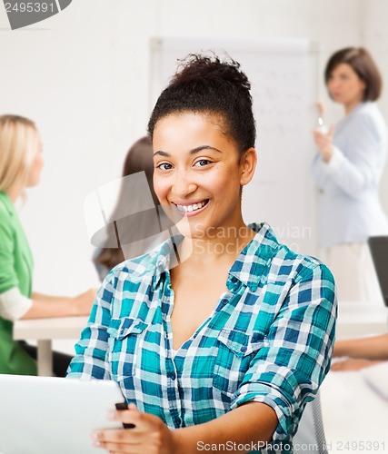 Image of student girl with tablet pc at school