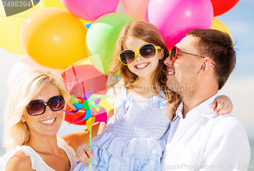 Image of family with colorful balloons