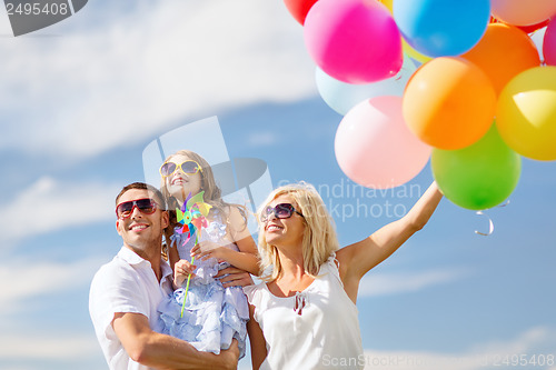 Image of family with colorful balloons