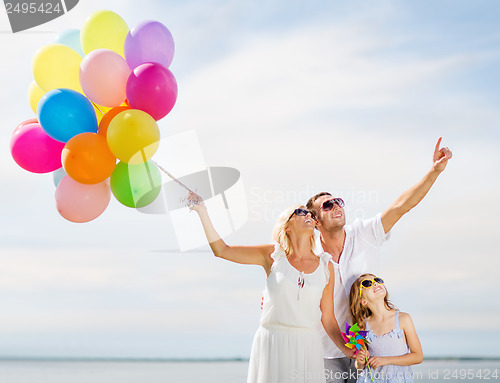 Image of family with colorful balloons