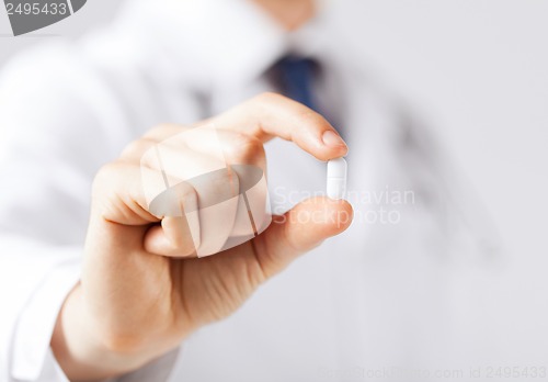 Image of doctor with pill in hospital